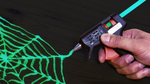 Glow in the dark hot glue spider web